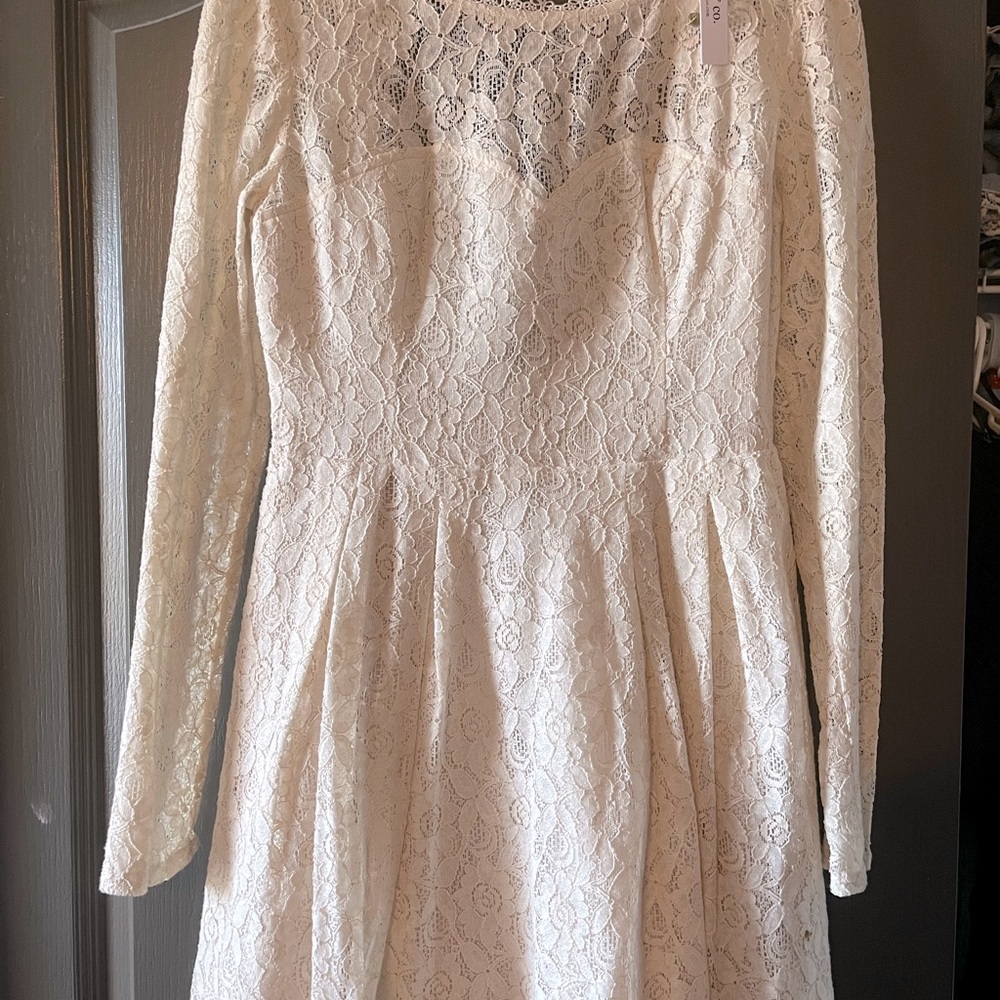 Size Medium cream colored long sleeve lace dress from Mod Clothloth